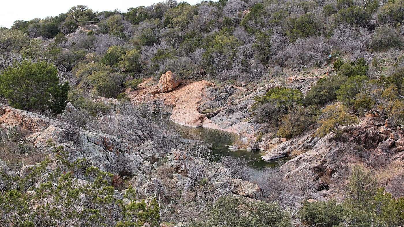 A view of Devil's Waterhole in Inks Lake State Park in Burnet County, Texas, United States from the Valley Spring Creek Trail.