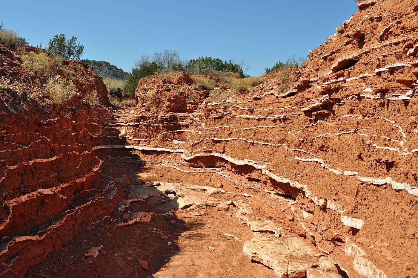Gypsum layers in a wash that have been exposed by erosion in Caprock Canyons State Park, Texas.
