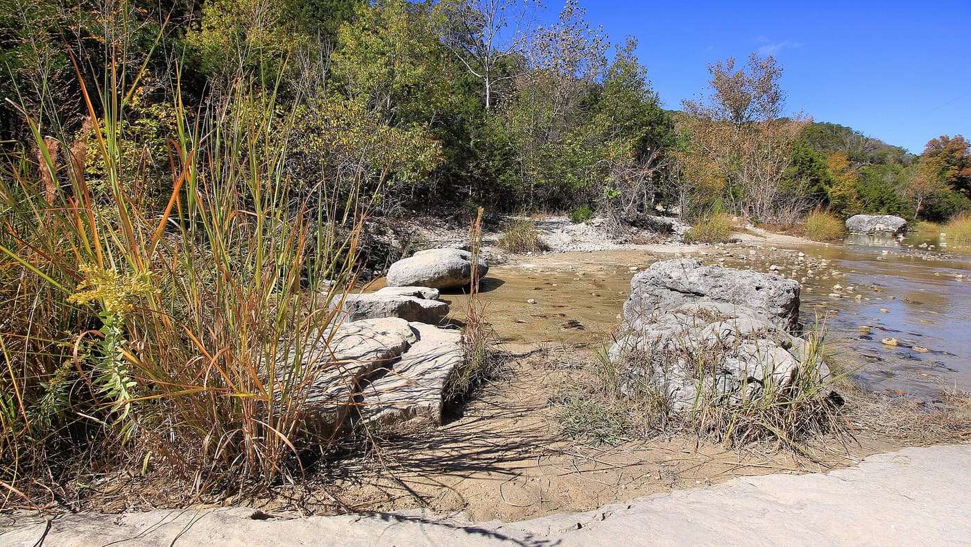 Rocks and boulders are used on the trails to aid hikers in crossing the creeks in Lost Maples State Natural Area near Vanderpool, Texas, United States.